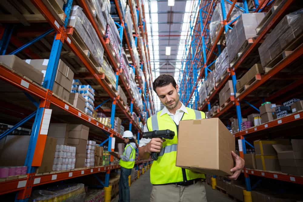warehouse worker scanning box with rf wireless device